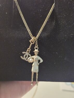 CHANEL Gold-Tone Pendant Necklace with White Enamel Figure and CC Charm